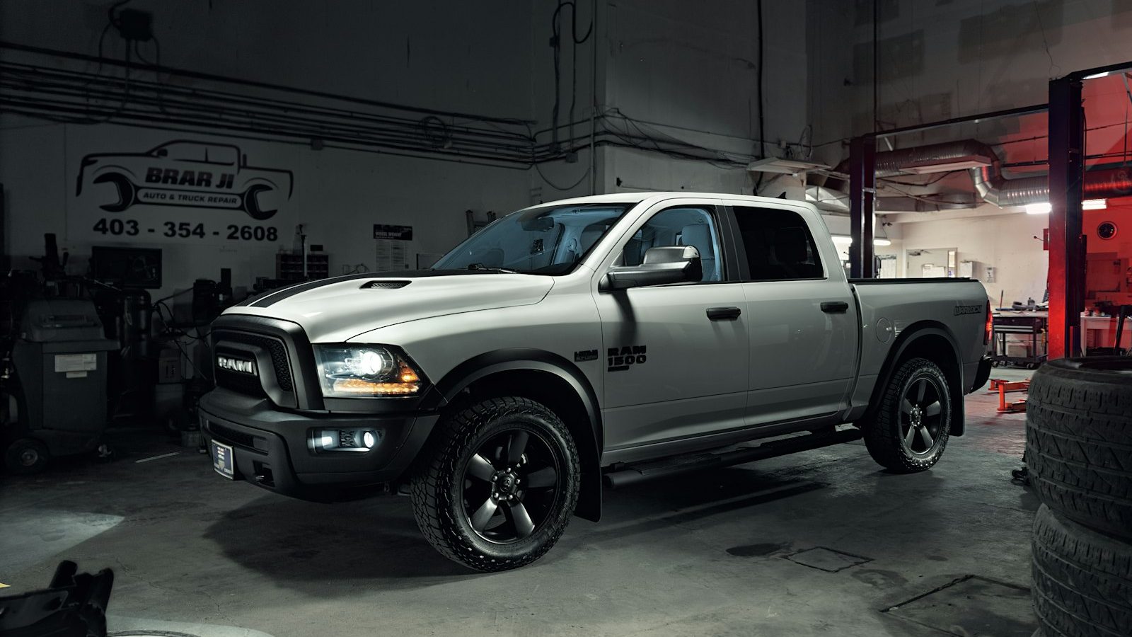 Pickup truck parked inside a repair shop