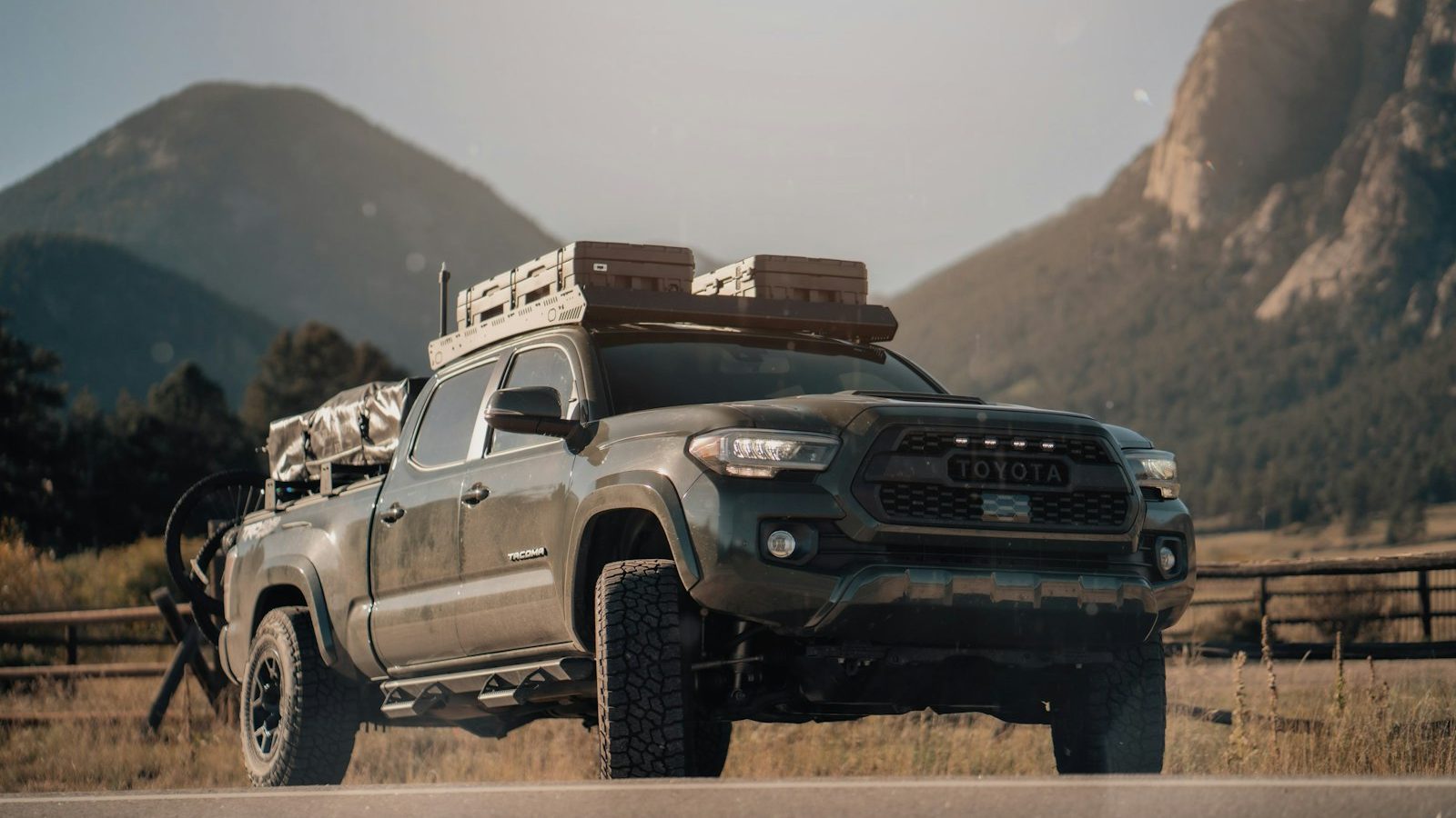 Toyota Tacoma overland build with a roof rack in the mountains